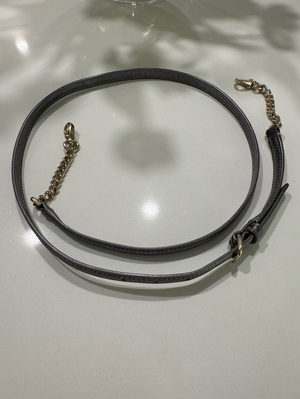 Kate Spade pewter cobbled leather crossbody strap